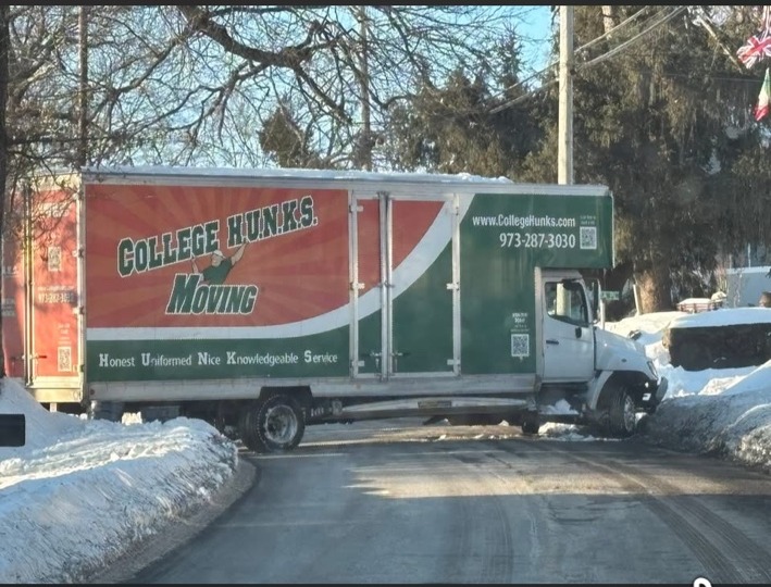 College Hunks truck blocking snowy Franklin Road