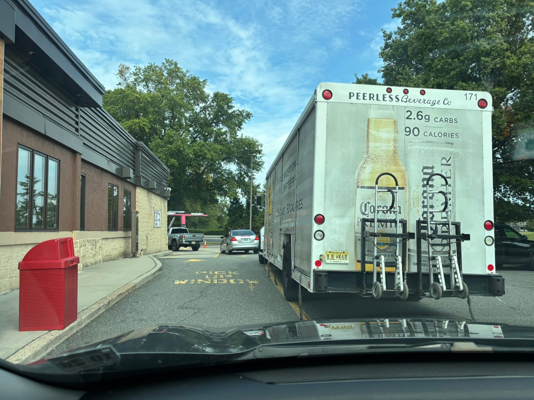 Large beverage truck in narrow drive-thru lane